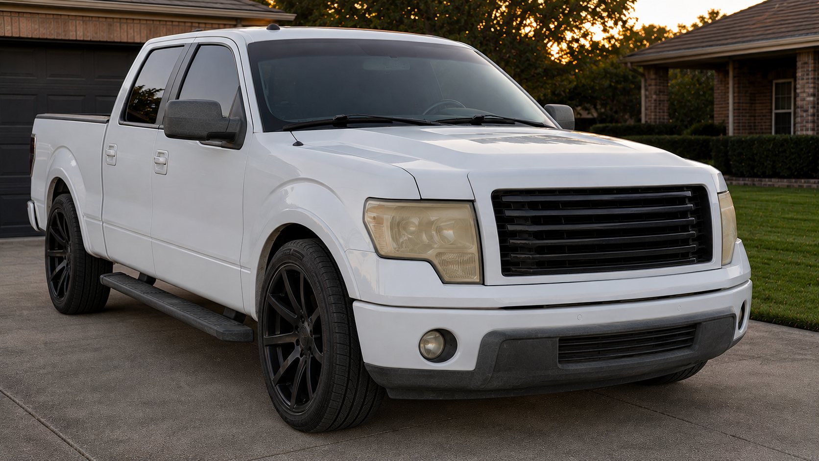 White luxury pickup with yellowed headlights